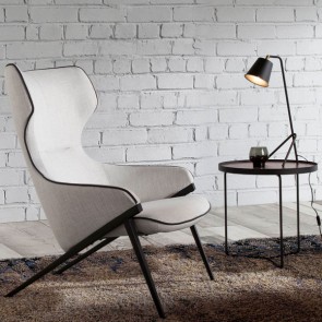 Poltrona soggiorno con seduta e schienale rivestiti in tessuto grigio. Poltrone salone con gambe in acciaio inox nero.